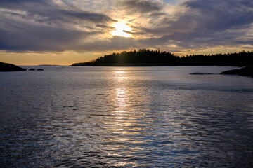 Naklejka premium Magical sunset in winter in January over Lake Vaettern in Skaraborg in Vaestra Goetaland in Sweden