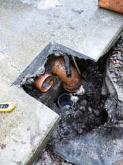 Broken pipes due to subsidence of building on a peatbog