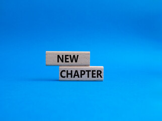 New Chapter symbol. Concept word New Chapter on wooden blocks. Beautiful blue background. Business and New Chapter concept. Copy space
