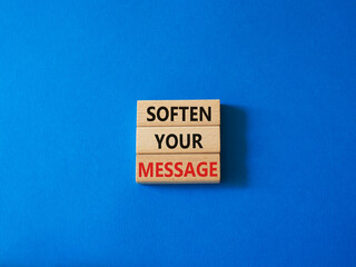 Soften your Message symbol. Concept words Soften your Message on wooden blocks. Beautiful blue background. Business concept. Copy space.