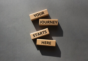 Your Journey starts here symbol. Concept word. Your Journey starts here on wooden blocks. Beautiful...