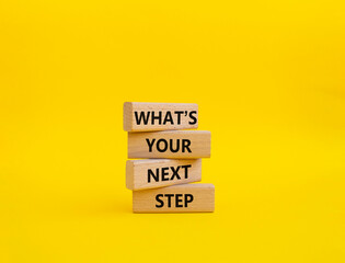 What is your next step symbol. Wooden blocks with words What is your next step. Beautiful yellow...