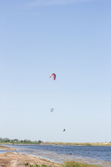 Fototapeta na wymiar Sportsman riding a kiteboard