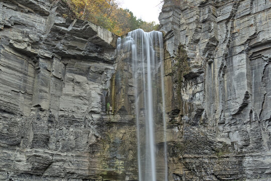 water flowing from a waterfall at Taughannock Falls State Park (cascade, cayuga lake near ithaca, upstate new york) finger lakes region in autumn, fall