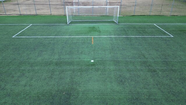 Drone aerial view of empty soccer football field without players during Covid-19 Coronavirus outbreak lockdown - sport activities 