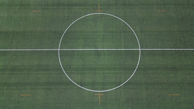 Drone aerial view of empty soccer football field without players during Covid-19 Coronavirus outbreak lockdown - sport activities 