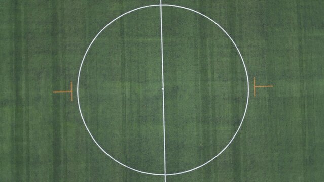 Drone aerial view of empty soccer football field without players during Covid-19 Coronavirus outbreak lockdown - sport activities 