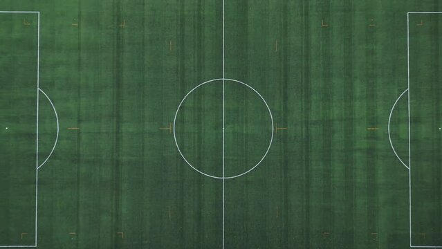 Drone aerial view of empty soccer football field without players during Covid-19 Coronavirus outbreak lockdown - sport activities 