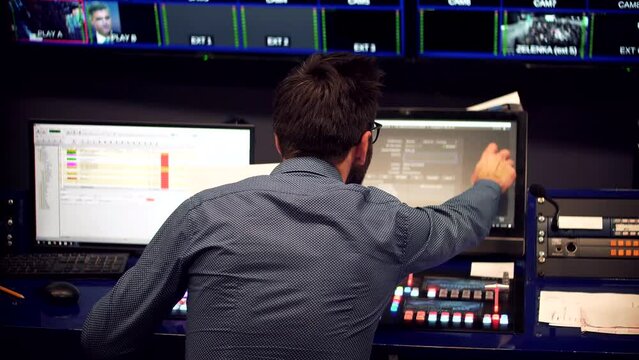 Studio director on video mixer broadcast TV station
