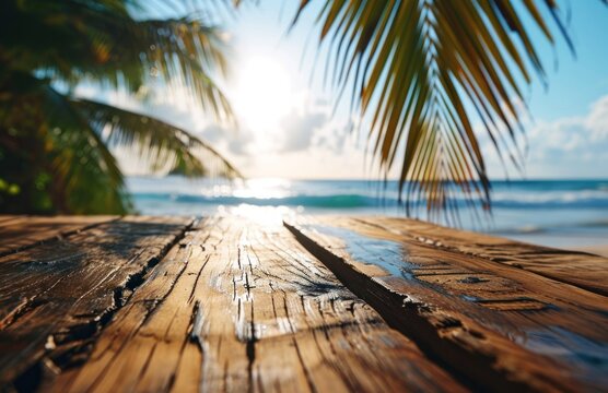 an image of wood table on the beach with palm tree leaves