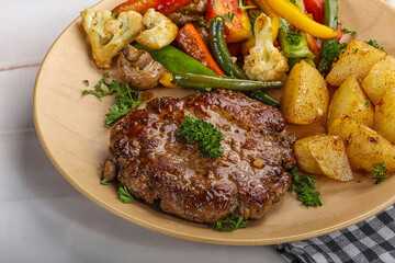 Roasted beef steak with potato
