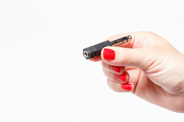 Audio connector holds a female hand