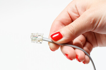 Telephone plug in hand