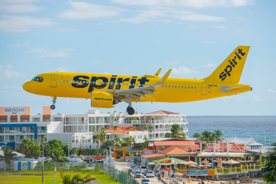 Spirit Airlines Airbus 320 flying over Maho Beach before landing on Princess Juliana International Airport SXM on Sint Maarten, Dutch Caribbean. 