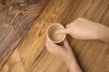 Hand Holds Cup, Empty Paper Cup in Hands, Coffee Mug, Teacup, Hot Beverage Mockup, Cup in Arms
