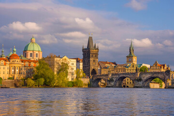 Charles Bridge (Karluv Most) on Vltava river and Old Town Bridge Tower, famous tourist destination...