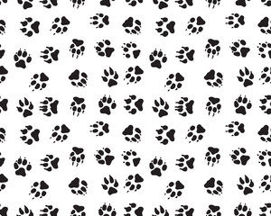 Seamless pattern with black silhouettes of trace of dogs