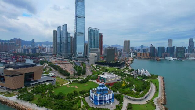 West Kowloon Cultural Area, A Waterfront Leisure Promenade Palace Museum Freespace near Tsim Sha Tsui, Central, Victoria Harbour, Hong Kong in the background, Aerial drone skyview