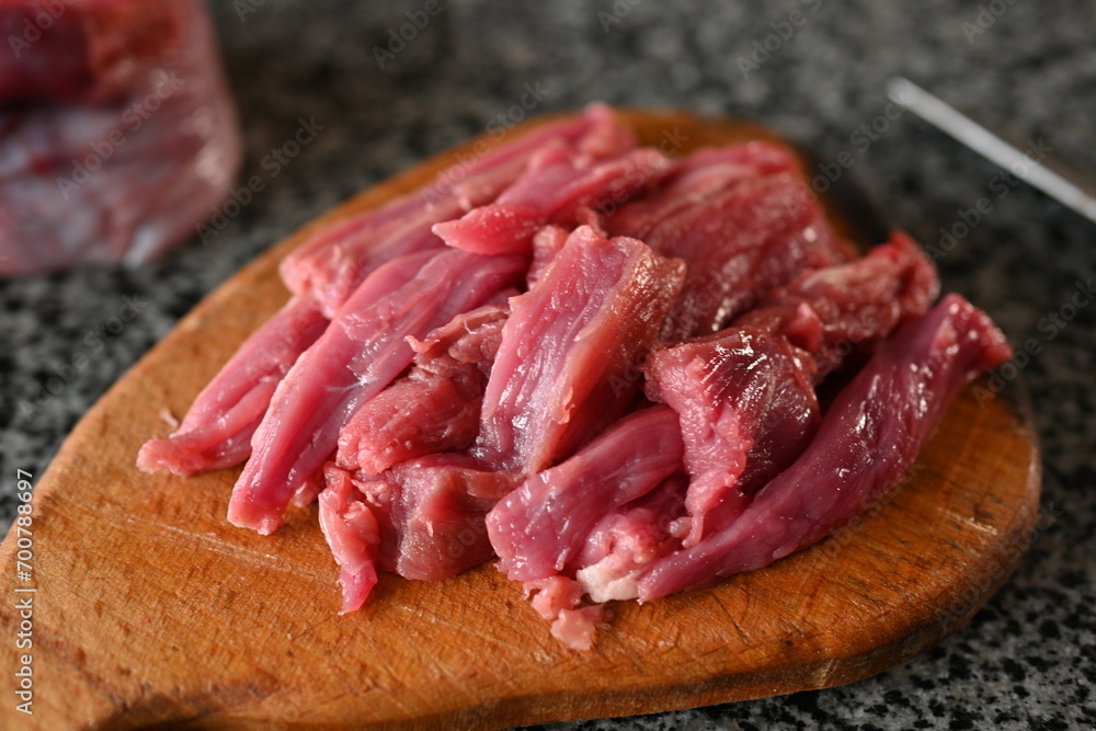 Wall mural sliced veal strips, beef goulash, red beef meat sliced for cooking