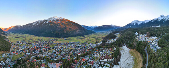 Aerial landscape view of the town Tarrenz in Austria with alps. 360 degrees panorama. Winter.