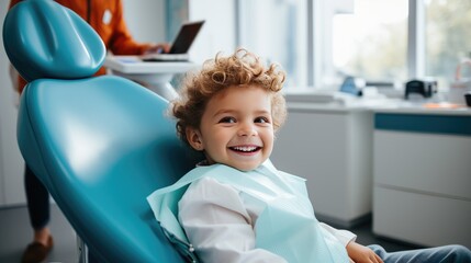 Portrait of young boy smilling sitting in dentist office chair