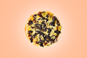 Vegan pizza on background of color of the year peach fuzz.