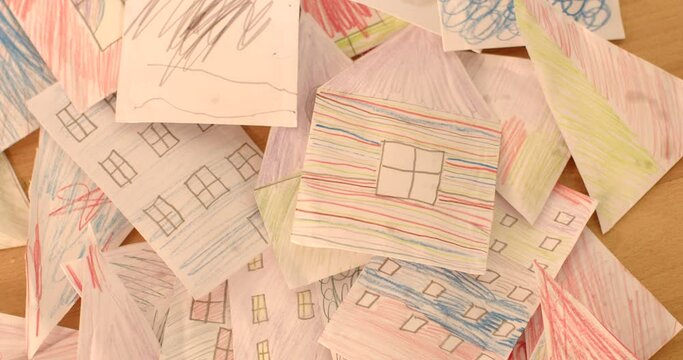 Educational Concepts: Paper crafts can be used to reinforce educational concepts such as shapes, colors in a playful and engaging manner. Close-up DIY paper draws made by kids.