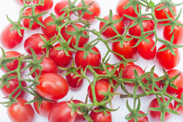 Top View of Fresh Cherry Tomato Branch Isolated on White Background
