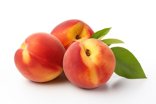 A high-quality image of three ripe peaches with a vibrant mix of red and yellow hues, accompanied by a single green leaf. The fruits are set against a pure white background, which highlights their col