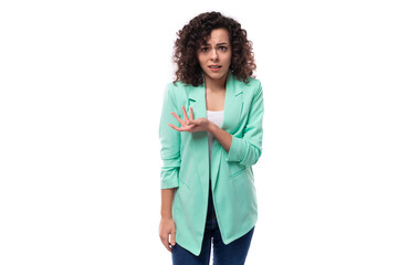 young authentic curly brunette assistant woman dressed in a blue jacket on a white background