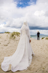 Fototapeta na wymiar Afghani bride's white wedding dress