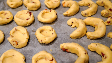 Naklejka premium Preparation of Greek cookies Kourabiedes, a type of traditional almond Christmas cookies
