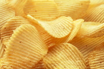 Beautiful ribbed potato chips in the sunlight.