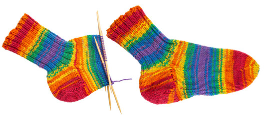 Knitted sock from yarn. Knitting needles. Handmade hobby knitting. Wooden bamboo needles for...