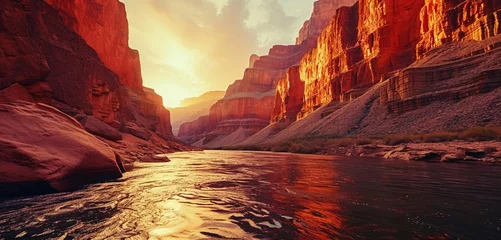 Foto auf Leinwand A majestic canyon river at sunrise, neon sunrise orange veins in the water and cliffs, presenting a breathtaking monochromatic sunrise orange canyon view, distant walls softly blurred © Tehreem