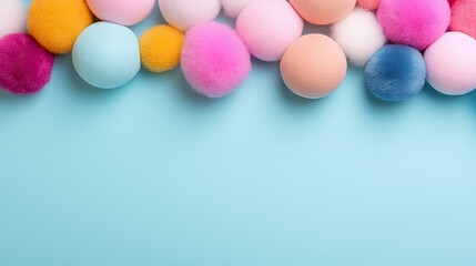 Graphic banner of colorful pastel felt craft pom poms, with copyspace