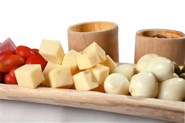 portion of cold snacks cheese ham olive oil
