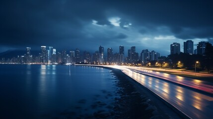 Obraz premium Enchanting Nightscapes: Illuminated Coastal Cityscape in Mesmerizing Long Exposure