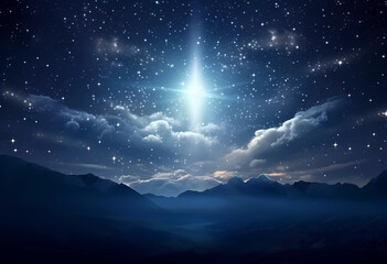 A star light shining in the sky over mountains
