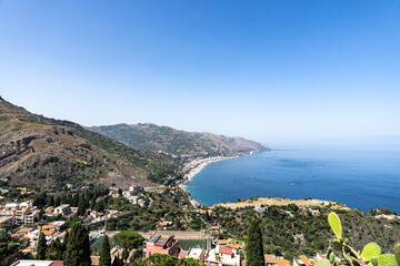 Aerial view of old town of Taormina and the Sea on a sunny day from ancient greek theatre, Sicily,...