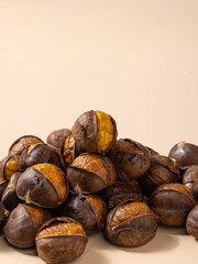 Cooked chestnuts (Castanea mollissima Blume) and sugar-fried chestnuts are popular Chinese street snacks with a sweet taste. Close-up of peeled chestnut
