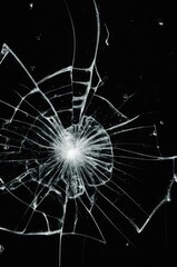 Broken glass on a black background, cracks, shards.
