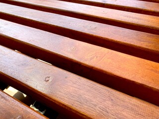 closeup image of wooden bench in the park, abstract texture background