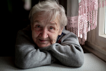 Close-up of a portrait of an elderly woman. - 700873674