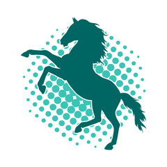 Silhouette of a horse standing on two hind legs. Silhouette of a stallion lifting front legs.