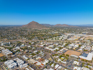 Scottsdale city center aerial view on Scottsdale Road at Main Street with Camelback Mountain at the...