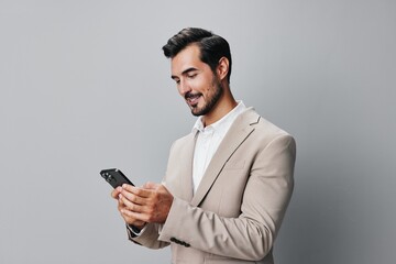 phone man entrepreneur smartphone suit hold call business smile portrait happy