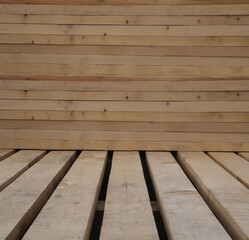Wooden boards, lumber, industrial wood, timber. Pine wood timber. Rough spruce and pine lumber pile at a sawmill. Pile of wooden boards at lumber production factory. beams,  plank background. material