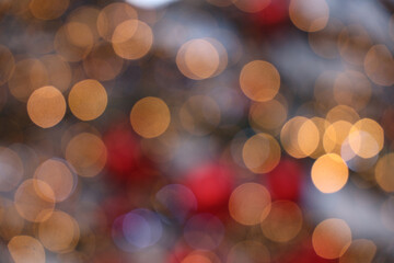 Many defocused bright lights and decorations on Christmas tree. Festive backdrop for your design....