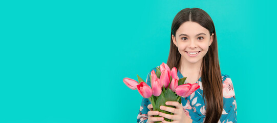happy child holding tulips. mothers or womens day. kid hold flowers for 8 of march. Banner of...